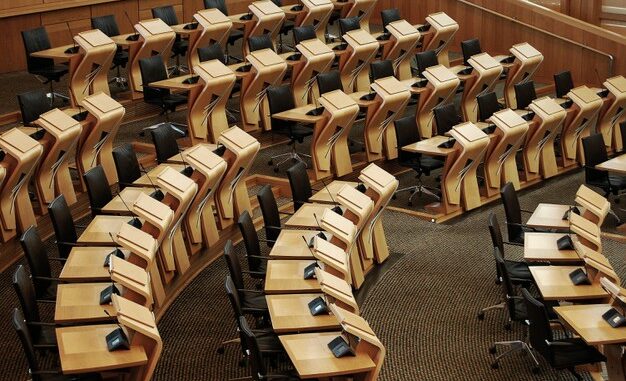 horizontal-shot-desks-inside-scottish-parliament-building_181624-15462